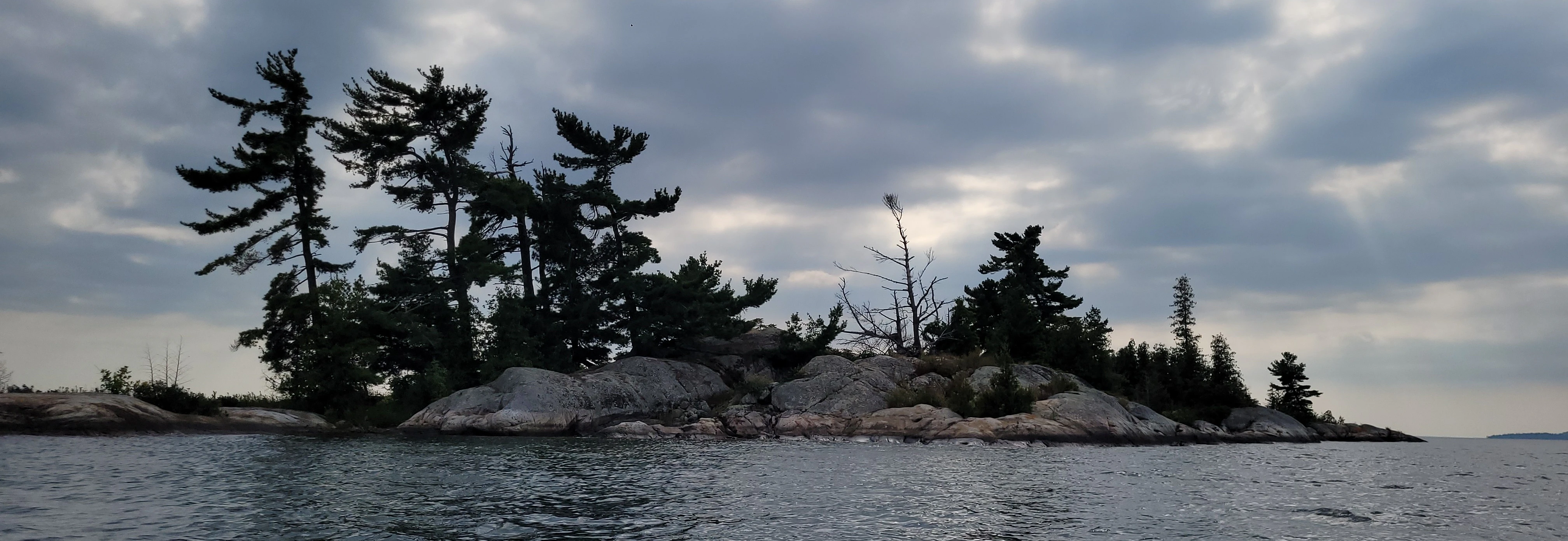 Smooth granite rocks from glacial erosion on Martins Island in the thirty thousand islands archipelago of the georgian bay